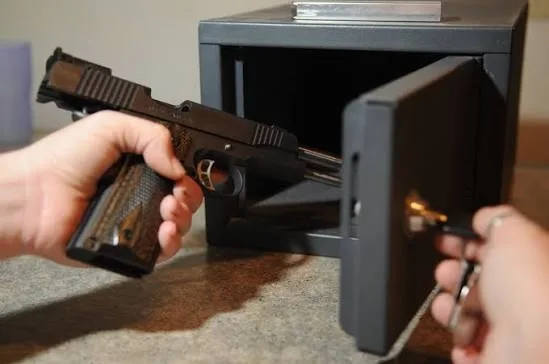 firearm being put in safe
